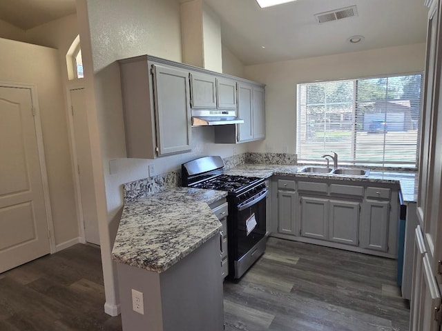 6173 N Marty Ave, Fresno, CA 93711 - kitchen featuring range with gas cooktop, under cabinet range hood, gray cabinets, dark wood finished floors, and lofted ceiling