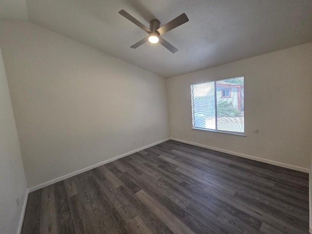 6173 N Marty Ave, Fresno, CA 93711 - unfurnished room featuring vaulted ceiling, dark wood-style flooring, and a ceiling fan