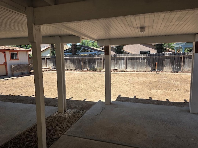 6173 N Marty Ave, Fresno, CA 93711 - fenced backyard with a storage unit and a patio area