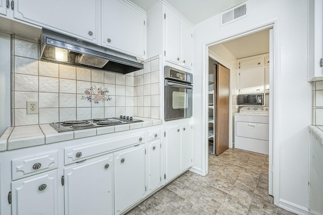 7343 N 4th St, Fresno, CA 93720 - kitchen featuring washer / clothes dryer, tile counters, black appliances, and under cabinet range hood