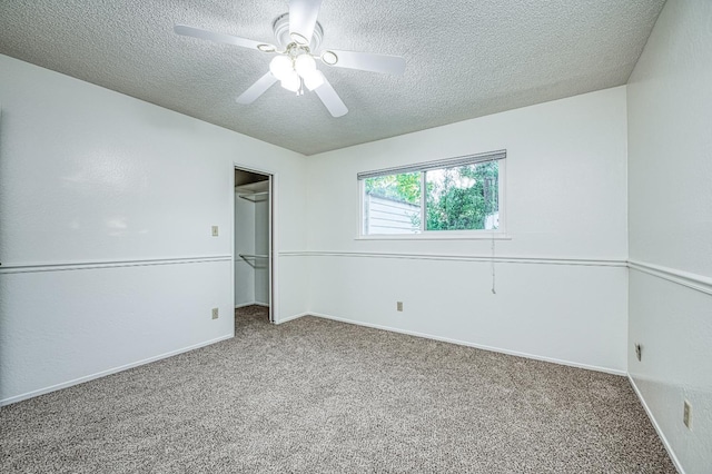 7343 N 4th St, Fresno, CA 93720 - unfurnished bedroom with a textured ceiling, carpet flooring, a spacious closet, and ceiling fan