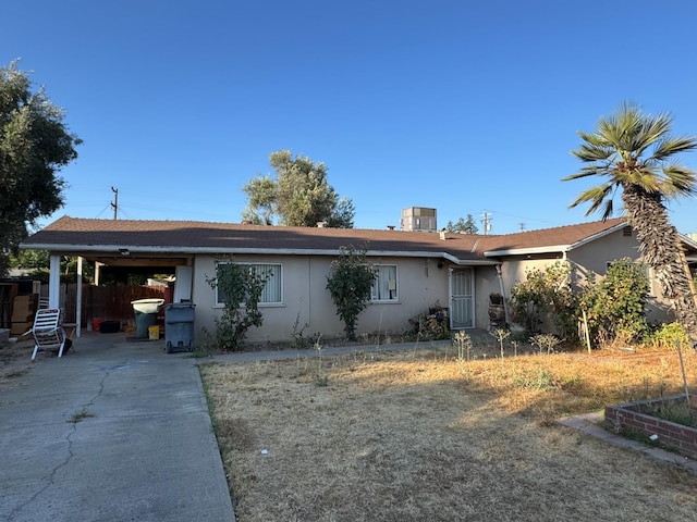 3635 W Cortland Ave, Fresno, CA 93722 - ranch-style home featuring stucco siding and an attached carport