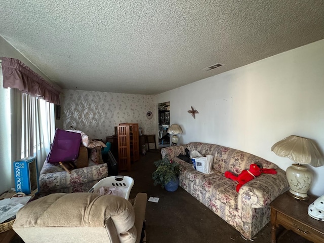 3635 W Cortland Ave, Fresno, CA 93722 - living area with a textured ceiling, wallpapered walls, and carpet flooring