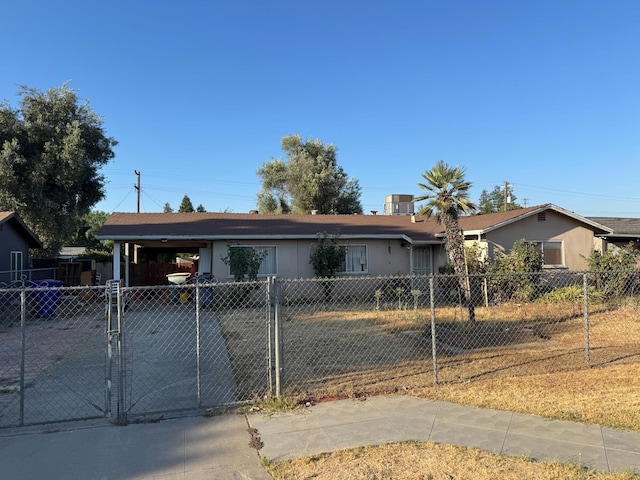 3635 W Cortland Ave, Fresno, CA 93722 - single story home with a fenced front yard, stucco siding, and a carport