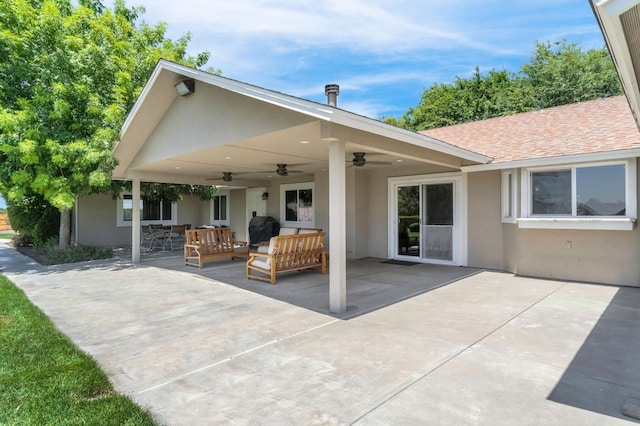 6421 S Greenwood Ave, Del Rey, CA 93616 - rear view of property featuring a ceiling fan, stucco siding, outdoor lounge area, a patio area, and a shingled roof