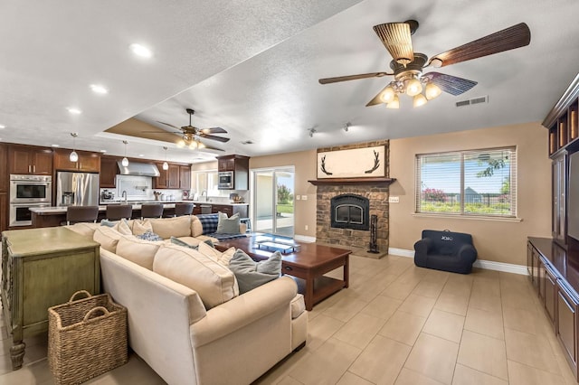 6421 S Greenwood Ave, Del Rey, CA 93616 - living area featuring ceiling fan, a fireplace, recessed lighting, and light tile patterned floors