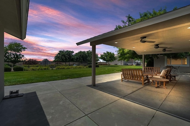 6421 S Greenwood Ave, Del Rey, CA 93616 - patio terrace at dusk with ceiling fan, a fenced backyard, and a patio