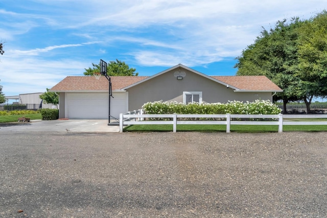 6421 S Greenwood Ave, Del Rey, CA 93616 - ranch-style home featuring an attached garage, concrete driveway, and stucco siding