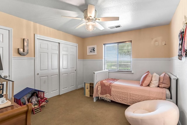 6421 S Greenwood Ave, Del Rey, CA 93616 - carpeted bedroom with ceiling fan, wainscoting, and a closet