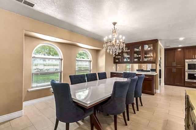 6421 S Greenwood Ave, Del Rey, CA 93616 - dining area with a chandelier, a textured ceiling, and recessed lighting