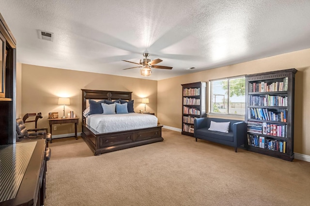 6421 S Greenwood Ave, Del Rey, CA 93616 - bedroom with light carpet, a textured ceiling, and ceiling fan