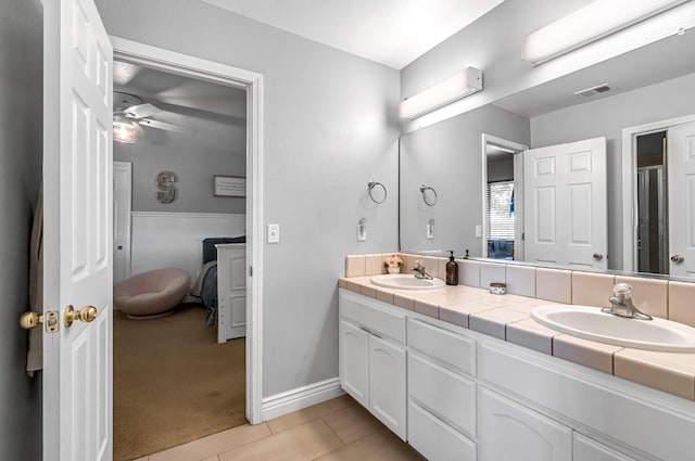 6421 S Greenwood Ave, Del Rey, CA 93616 - full bathroom with double vanity, tile patterned floors, ensuite bathroom, and a ceiling fan