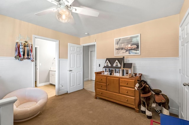 6421 S Greenwood Ave, Del Rey, CA 93616 - living area featuring a ceiling fan, wainscoting, and carpet