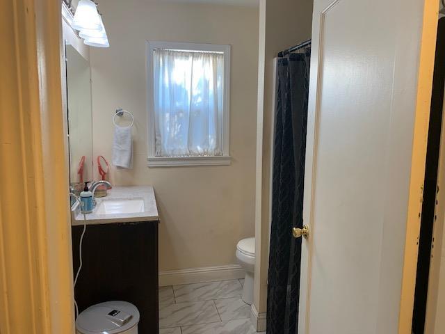 3614 E Washington Ave, Fresno, CA 93702 - bathroom with marble look tiles and vanity