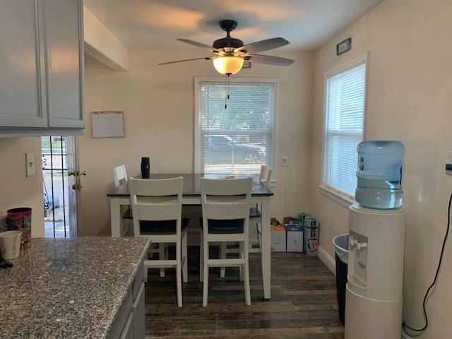 3614 E Washington Ave, Fresno, CA 93702 - dining space with ceiling fan and dark wood finished floors