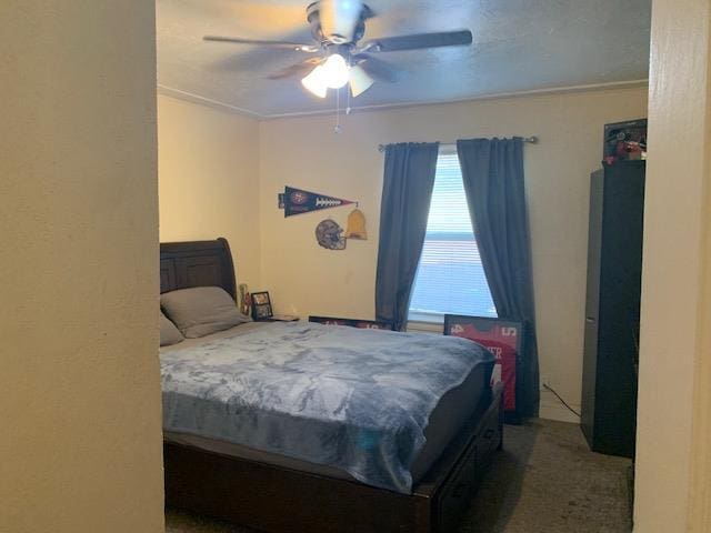 3614 E Washington Ave, Fresno, CA 93702 - carpeted bedroom with crown molding and a ceiling fan
