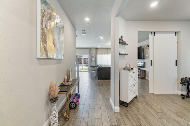 6236 E Garland Ave, Fresno, CA 93727 - corridor with light wood-style flooring and recessed lighting