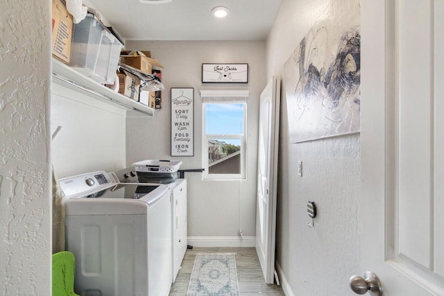 6236 E Garland Ave, Fresno, CA 93727 - washroom featuring washing machine and dryer and light wood finished floors