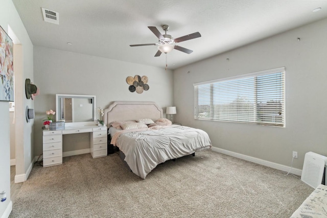 6236 E Garland Ave, Fresno, CA 93727 - bedroom featuring light colored carpet and a ceiling fan