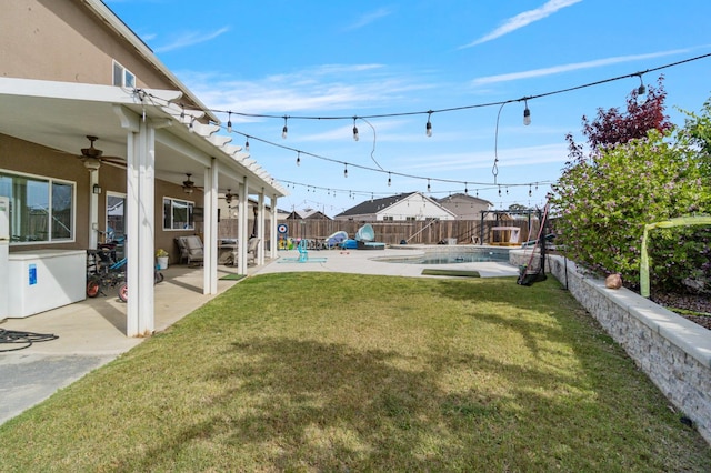 6236 E Garland Ave, Fresno, CA 93727 - fenced backyard with ceiling fan and a patio area