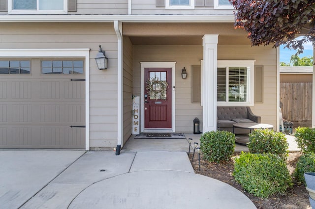 6236 E Garland Ave, Fresno, CA 93727 - entrance to property with a porch, a garage, and concrete driveway