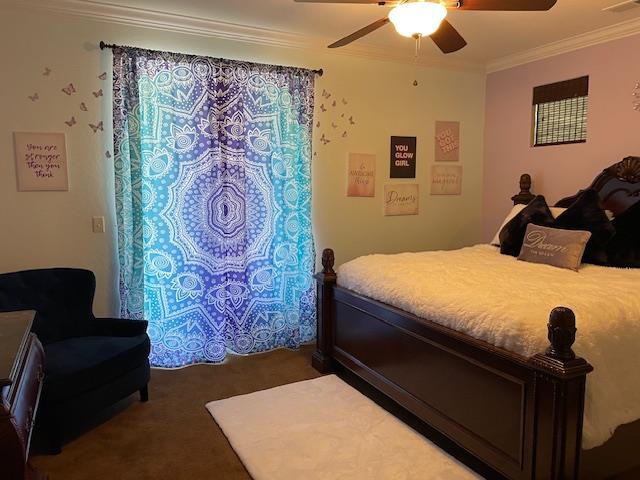 2291 E Prestwick Ave, Fresno, CA 93730 - bedroom featuring crown molding, carpet, and a ceiling fan
