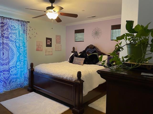 2291 E Prestwick Ave, Fresno, CA 93730 - bedroom featuring ornamental molding, ceiling fan, and carpet flooring
