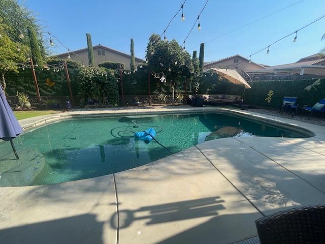 2291 E Prestwick Ave, Fresno, CA 93730 - view of swimming pool featuring a fenced backyard and a patio area