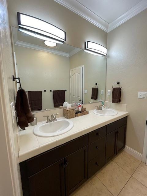 2291 E Prestwick Ave, Fresno, CA 93730 - full bathroom featuring double vanity, ornamental molding, and tile patterned floors