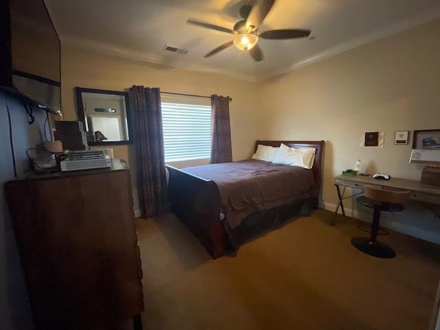 2291 E Prestwick Ave, Fresno, CA 93730 - bedroom featuring ornamental molding, light carpet, and a ceiling fan