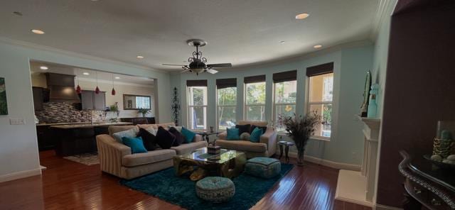 2291 E Prestwick Ave, Fresno, CA 93730 - living area featuring crown molding, ceiling fan, dark wood-style flooring, and recessed lighting