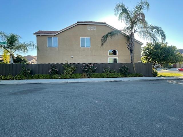 2291 E Prestwick Ave, Fresno, CA 93730 - view of side of home featuring stucco siding