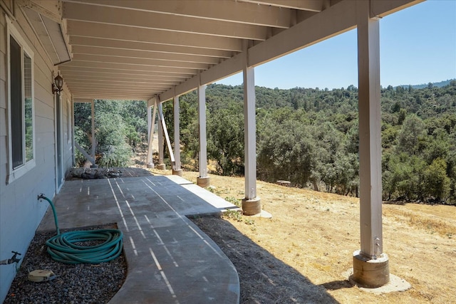 39397 Moonray Ln, Oakhurst, CA 93644 - view of patio featuring a wooded view