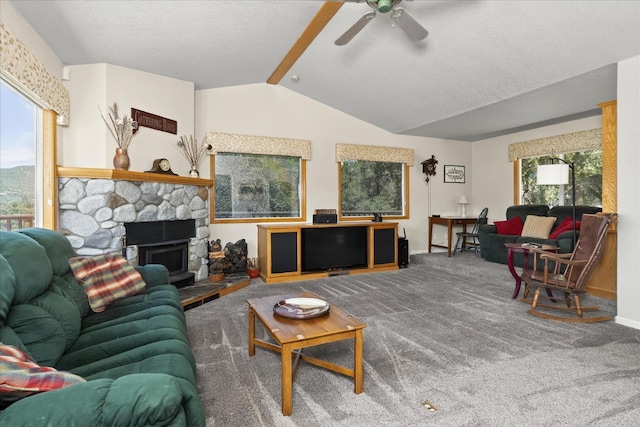 39397 Moonray Ln, Oakhurst, CA 93644 - living room featuring ceiling fan, a fireplace, carpet, and a textured ceiling