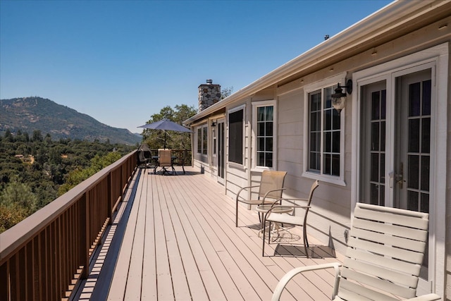39397 Moonray Ln, Oakhurst, CA 93644 - wooden terrace with a mountain view, outdoor dining area, and french doors