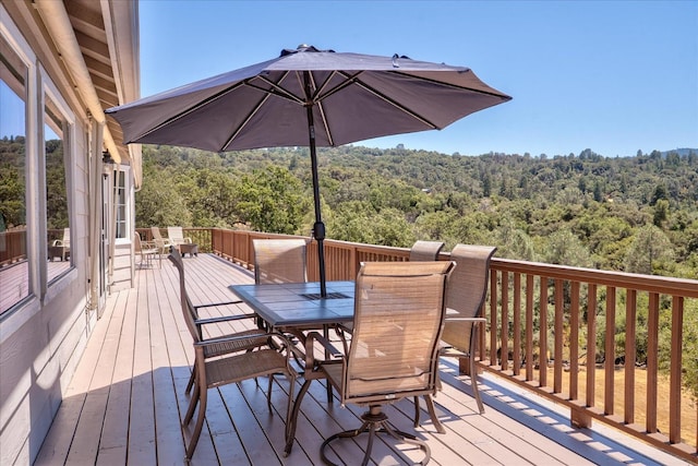 39397 Moonray Ln, Oakhurst, CA 93644 - wooden deck featuring a wooded view and outdoor dining area