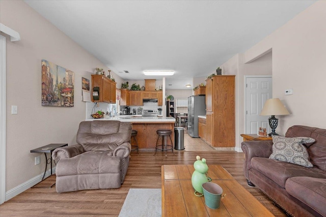 6164 W Keats, Fresno, CA 93723 - living room with light wood-style floors and baseboards