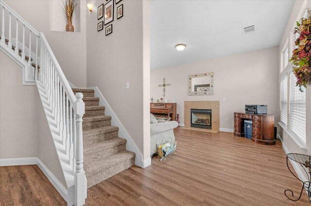 6164 W Keats, Fresno, CA 93723 - staircase with wood finished floors and a fireplace
