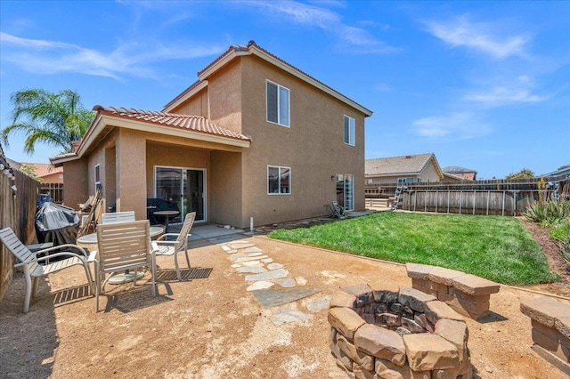 6164 W Keats, Fresno, CA 93723 - rear view of house with an outdoor fire pit, a fenced backyard, stucco siding, and a patio