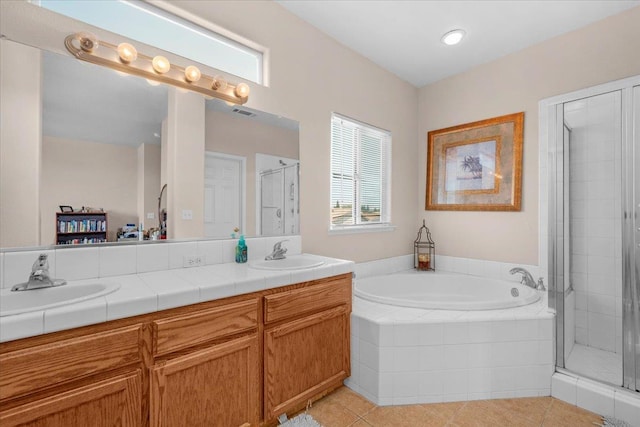 6164 W Keats, Fresno, CA 93723 - full bathroom featuring healthy amount of natural light, double vanity, a garden tub, and a shower stall