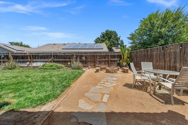 6164 W Keats, Fresno, CA 93723 - fenced backyard featuring a fire pit, a patio area, and outdoor dining area