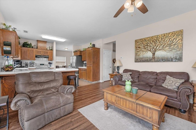6164 W Keats, Fresno, CA 93723 - living room featuring light wood-style floors and a ceiling fan