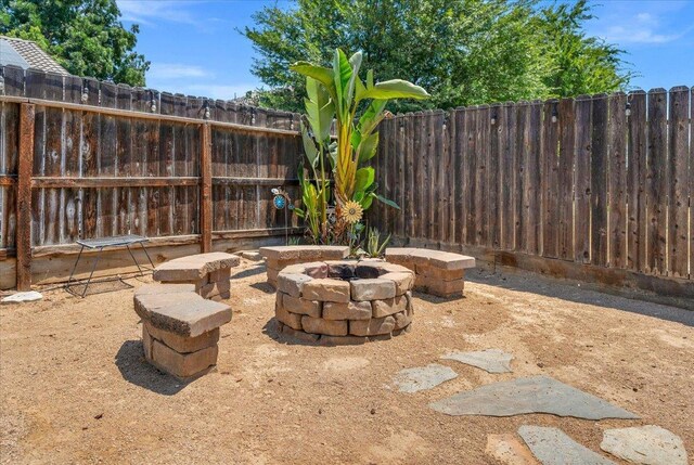 6164 W Keats, Fresno, CA 93723 - fenced backyard with an outdoor fire pit