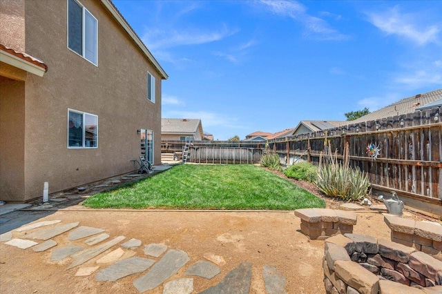 6164 W Keats, Fresno, CA 93723 - fenced backyard with a fire pit and a patio