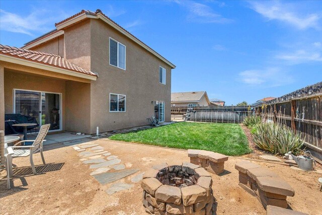 6164 W Keats, Fresno, CA 93723 - fenced backyard featuring a fire pit and a patio