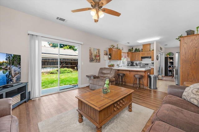 6164 W Keats, Fresno, CA 93723 - living area featuring light wood finished floors and a ceiling fan