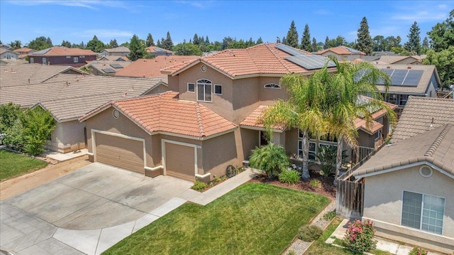 6164 W Keats, Fresno, CA 93723 - mediterranean / spanish home featuring stucco siding, a tiled roof, and a garage