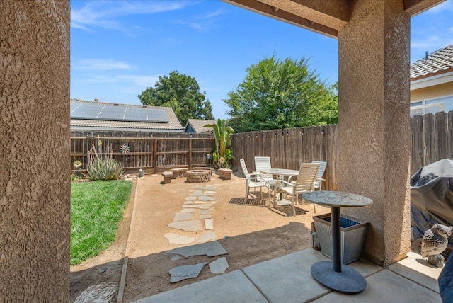 6164 W Keats, Fresno, CA 93723 - fenced backyard featuring an outdoor fire pit, a patio, and a grill