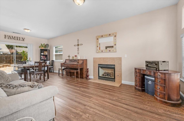 6164 W Keats, Fresno, CA 93723 - living room featuring wood finished floors and a fireplace