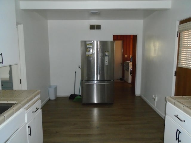 935 S Park Circle Dr, Fresno, CA 93727 - kitchen featuring freestanding refrigerator, tile countertops, dark wood-type flooring, and white cabinetry